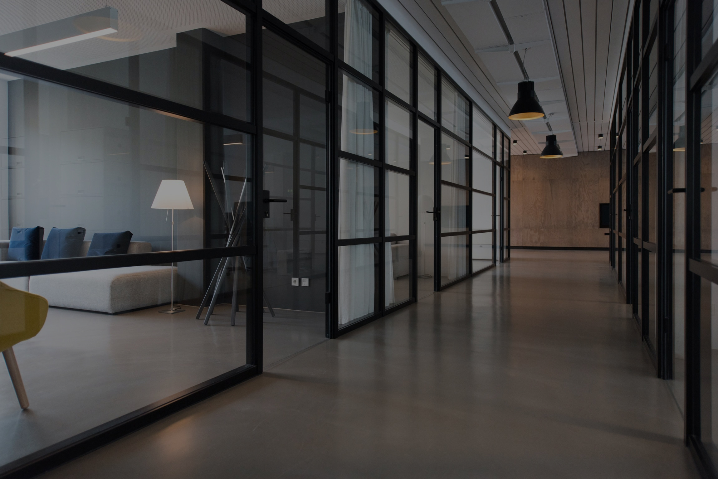 Modern commercial office with glass-walled rooms